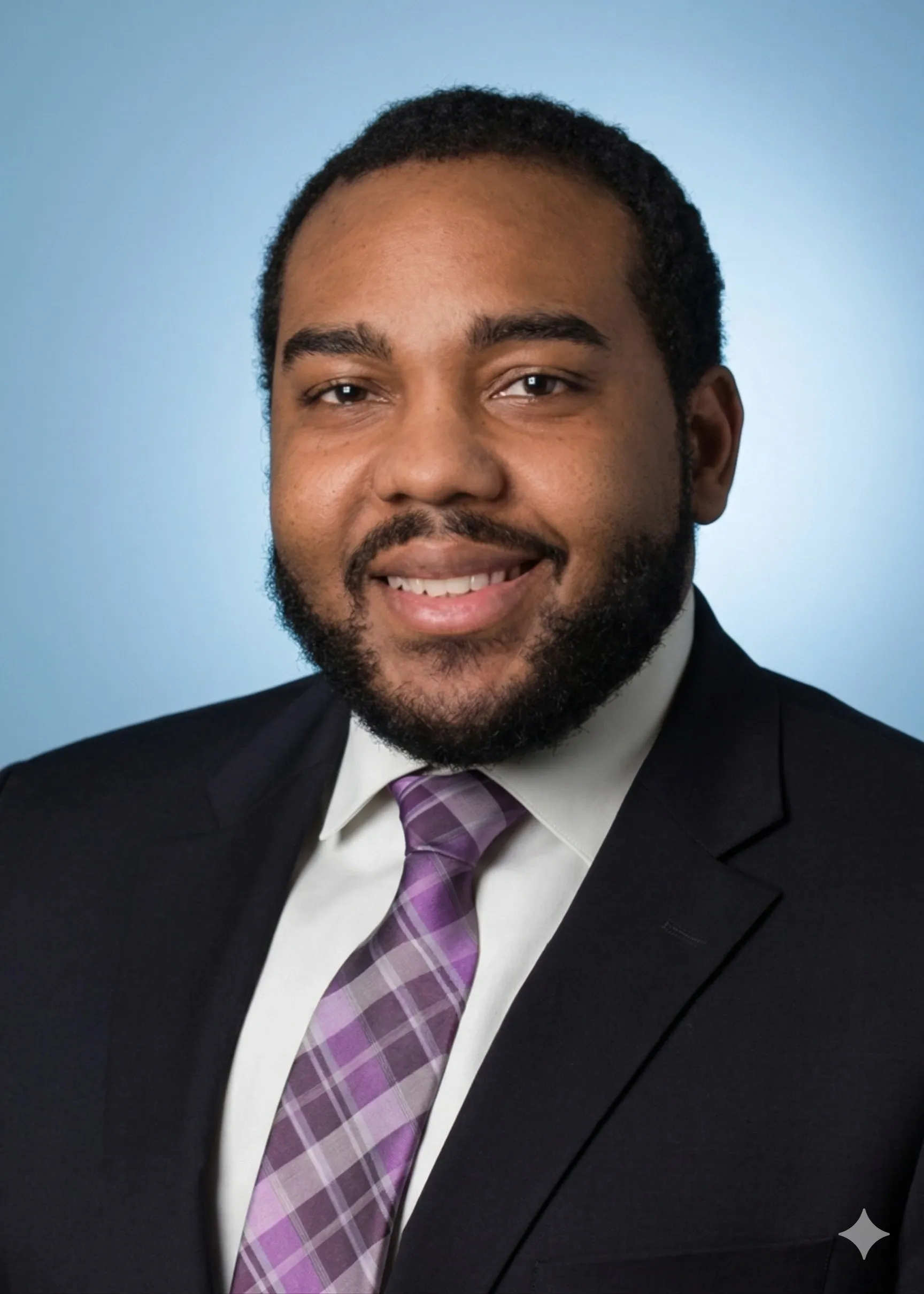 Smiling person in suit with purple tie